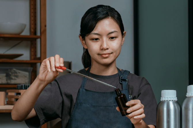 Chew Jia Tian, founder of Rough Beauty experimenting with fragrances for The Clan Hotel Singapore